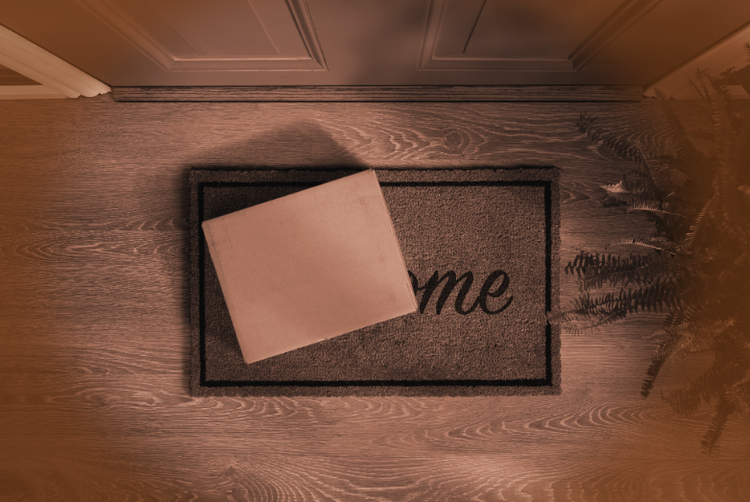 a box sitting at the front door of someone's home